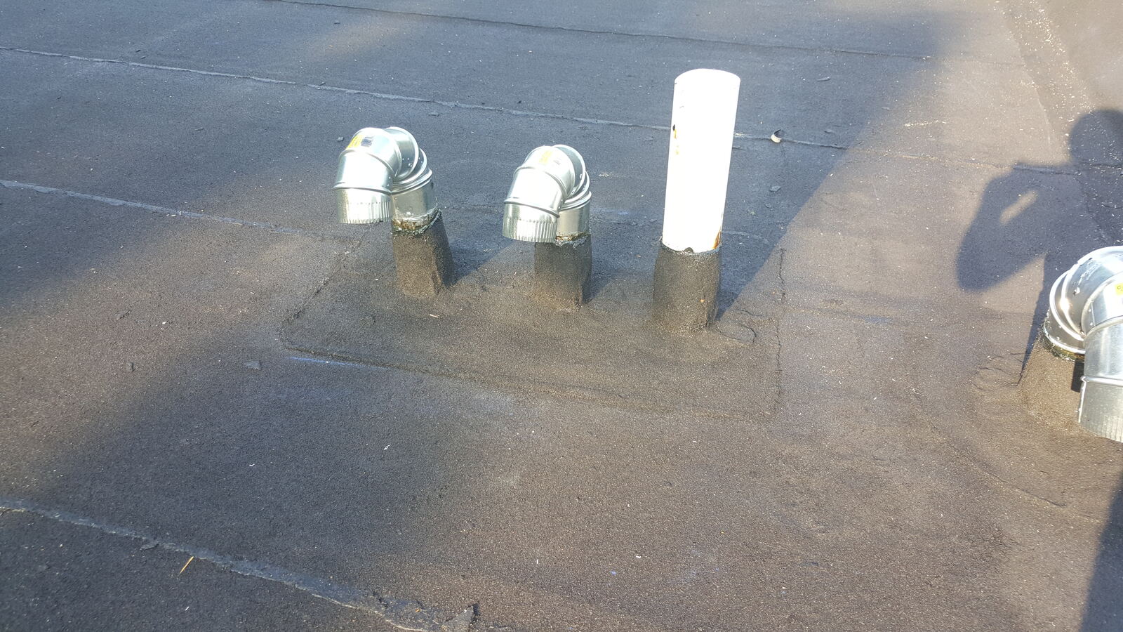 Granulated rubber roof pipe and vent flashing detail