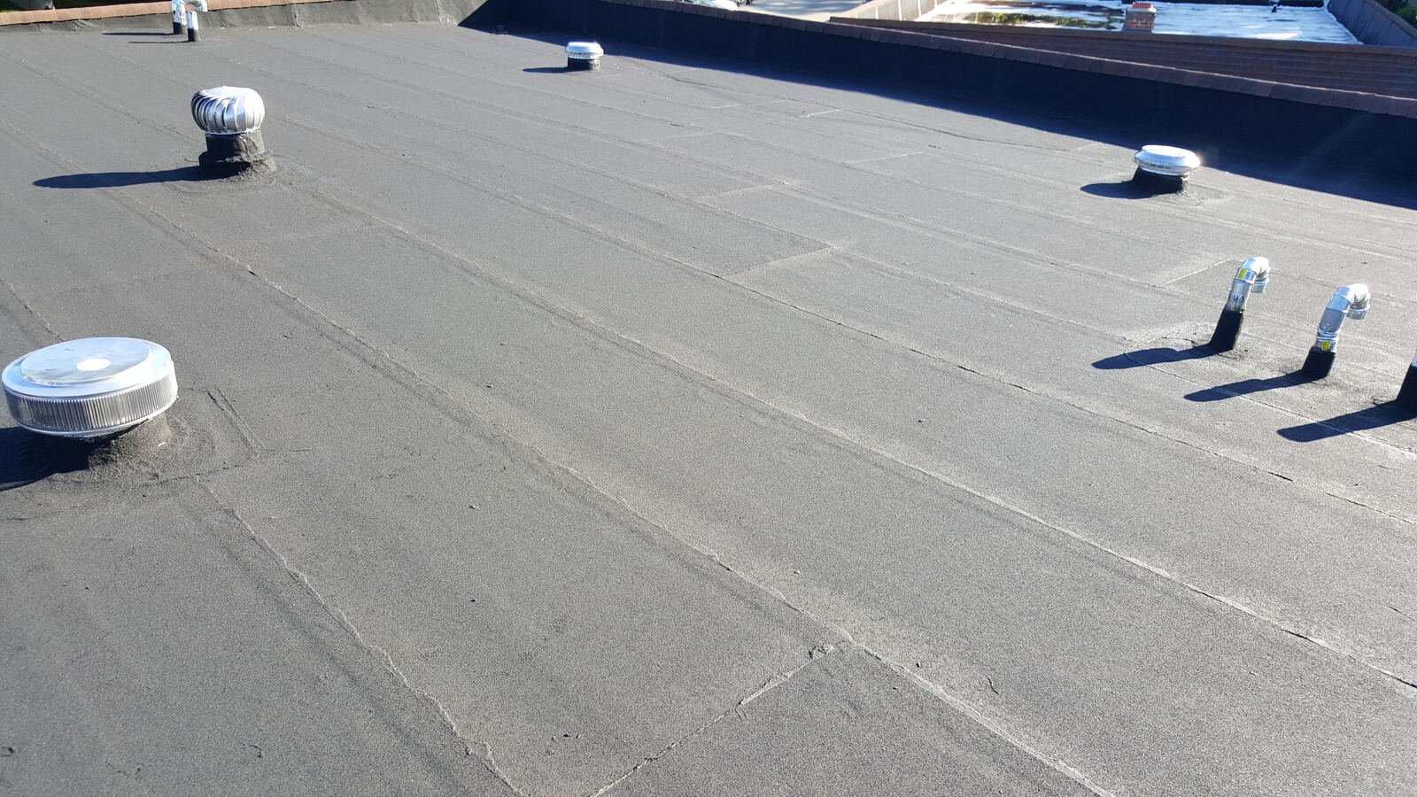 Completed granulated rubber roofing system