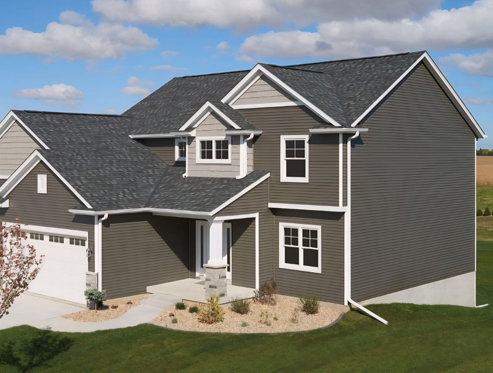Dimensional shingle roof on two-story home